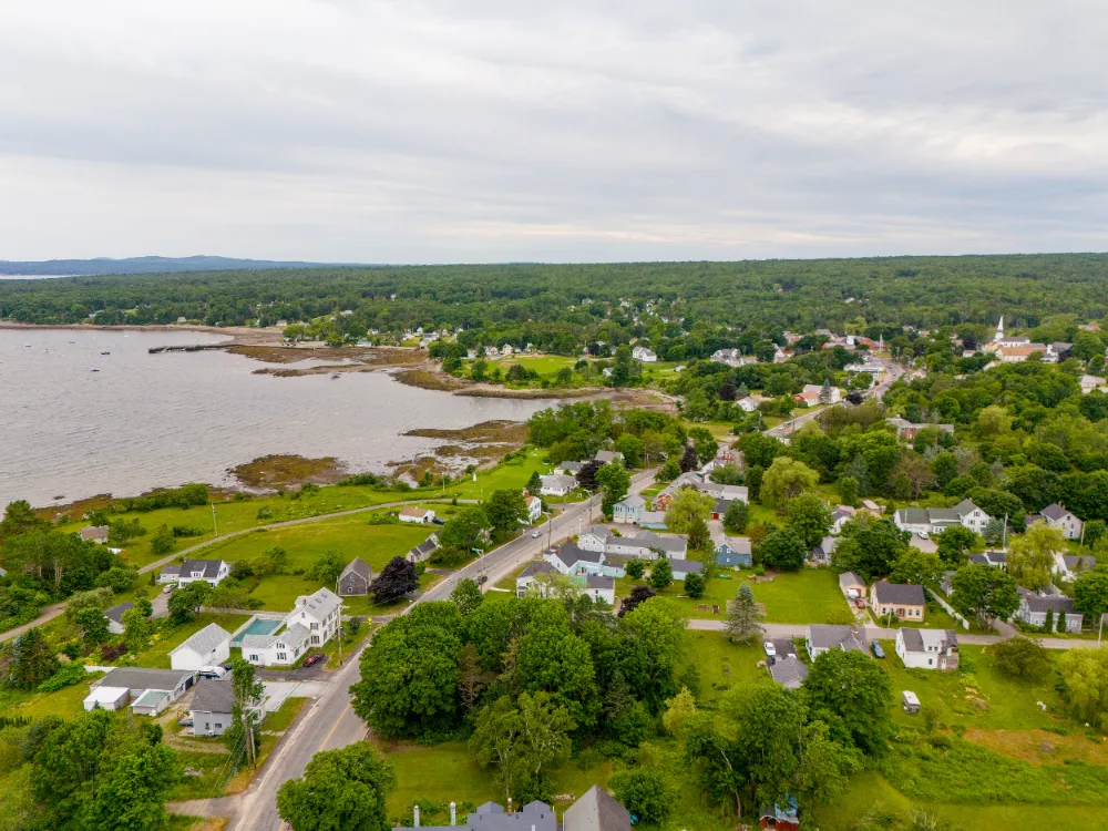 Aerial view of Searsport, Maine’s coastal homes and neighborhoods, representing Restorations Unlimited’s whole-home renovation services